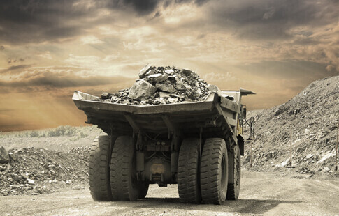 Large mining dump truck loaded with rocks